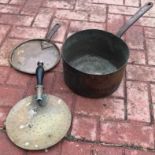 A Victorian copper saucepan