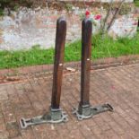 A pair of vintage wooden tennis court posts