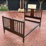 An Edwardian inlaid double bedstead