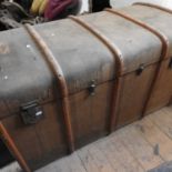 An early 20th century wooden bound travel trunk