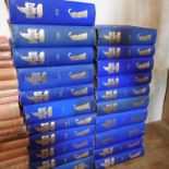 A collection of blue bound book containing Punch