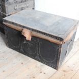 A 19th century black brass studded trunk