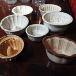 A collection of 19th century pottery jelly moulds