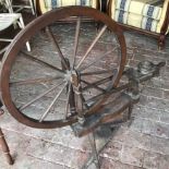A 19th century wooden spinning wheel