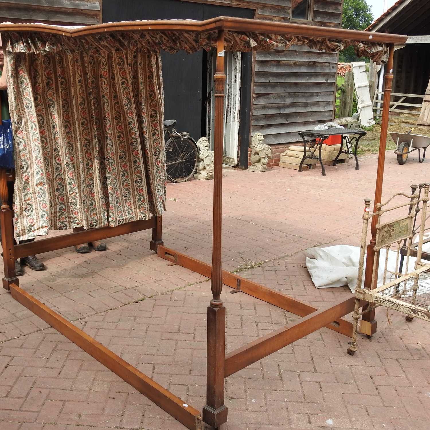 A 20th century four poster bedstead