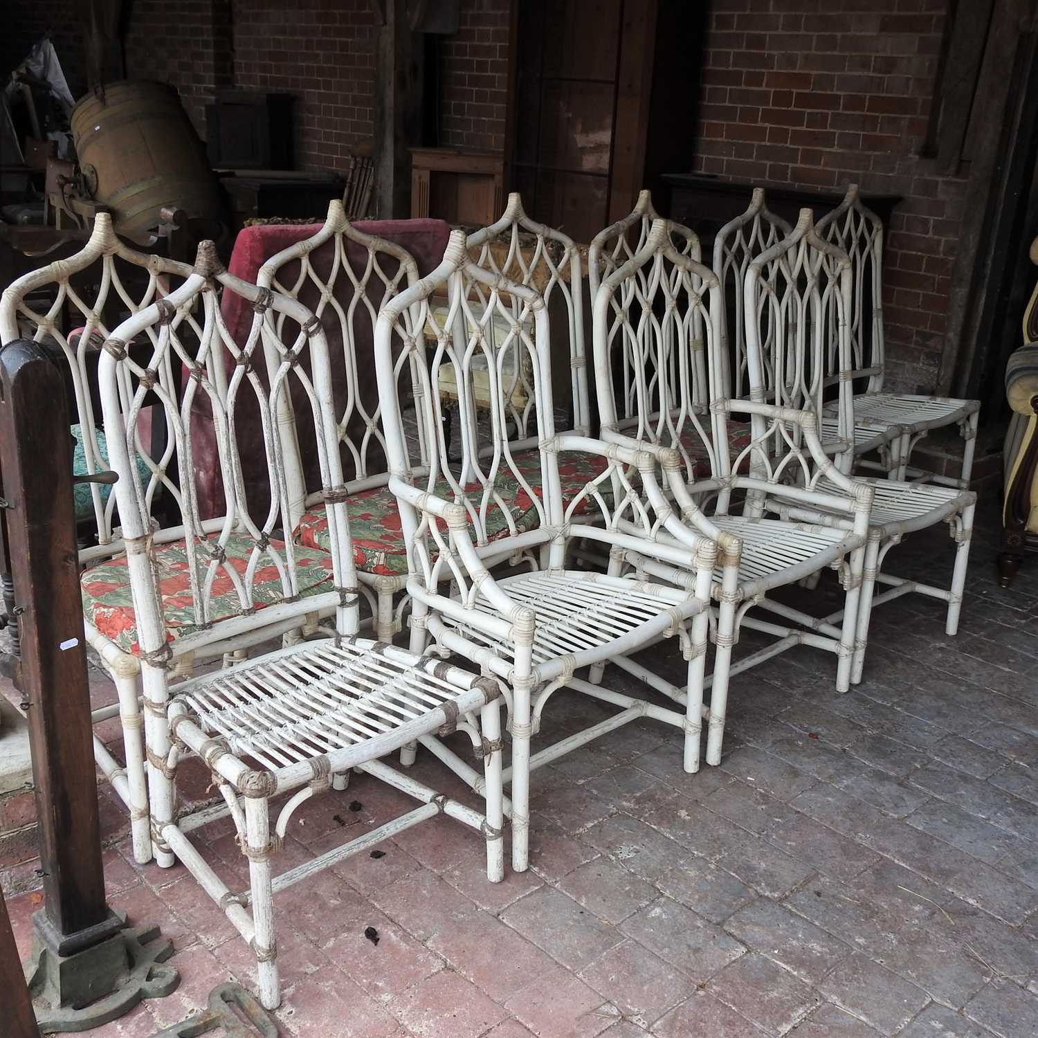 A collection of ten white painted bamboo chairs