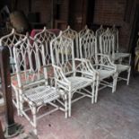 A collection of ten white painted bamboo chairs