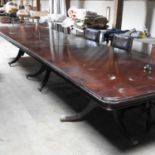 A large reproduction mahogany triple pillar boardroom table