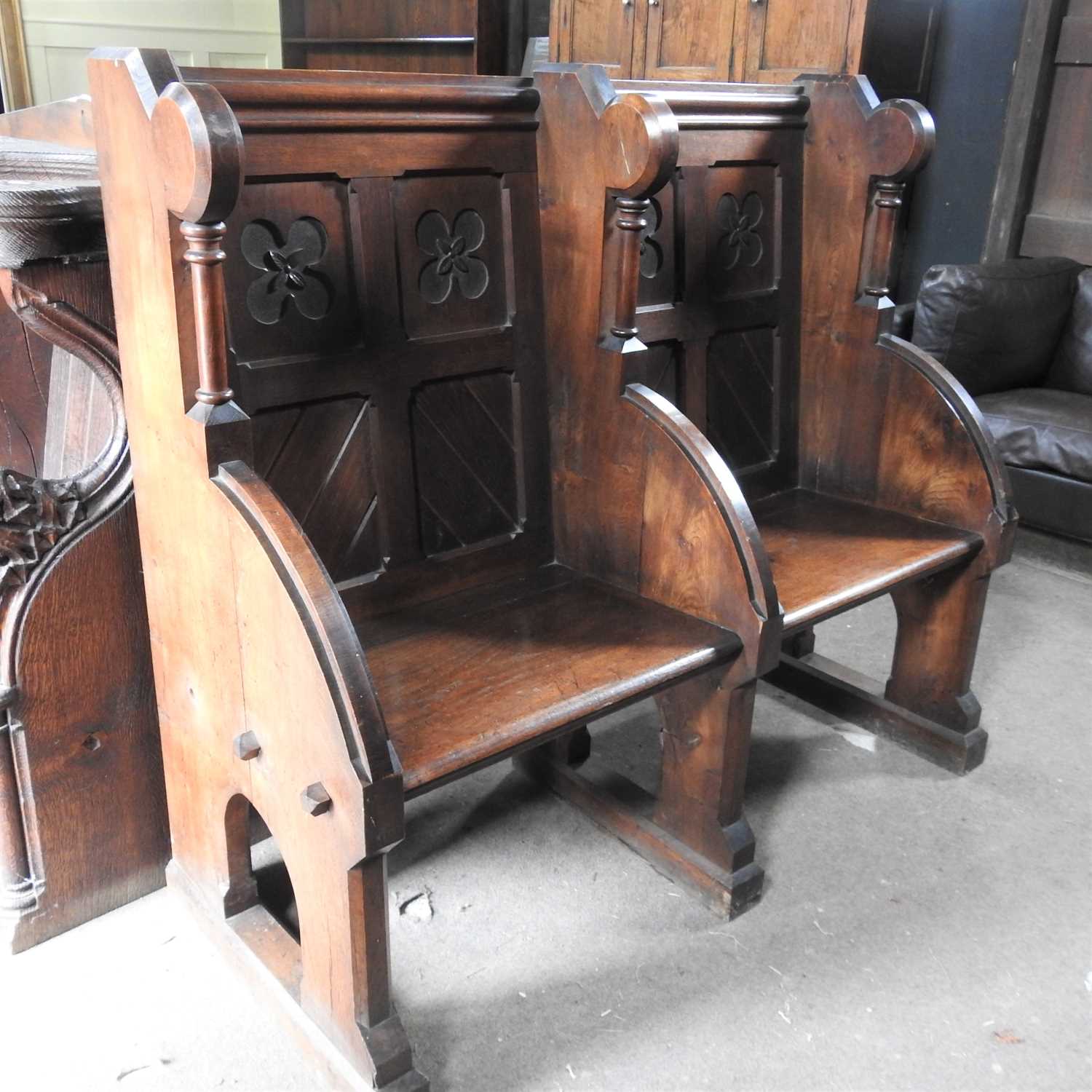 A Victorian carved oak double pew