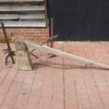 A 19th century wooden cart jack