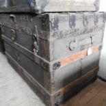 A large 19th century wooden and metal bound trunk