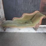 A Victorian mahogany and green upholstered chaise longue