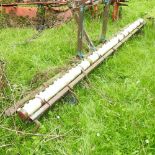 A tractor mounted weed wiper