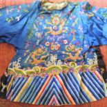 An early 20th century Chinese blue silk embroidered jacket