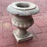 A carved marble garden urn