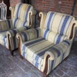 A blue and yellow upholstered three piece suite