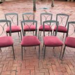 A set of eight metal framed dining chairs