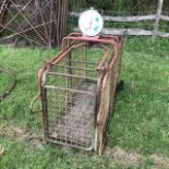 A pig weighing crate