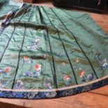 A Chinese green silk richly embroidered skirt