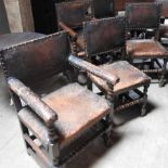 A set of six oak and studded leather dining chairs