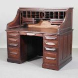 A mid 20th century American walnut tambour top desk