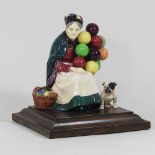 A Royal Doulton Balloon Seller and Bulldog