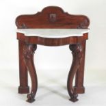 A Victorian carved mahogany marble top console table