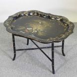 A 1930's chinoiserie papier mache tray on stand