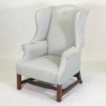A Georgian style wing back armchair