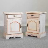 A pair of French style cream painted pine bedside cupboards