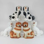 A pair of 19th century Staffordshire pottery models of seated spaniels