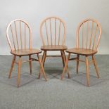 A set of three Ercol light elm spindle back dining chairs