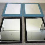 A pair of blue painted wall mirrors