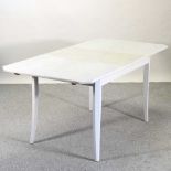 A mid 20th century and later cream painted dining table
