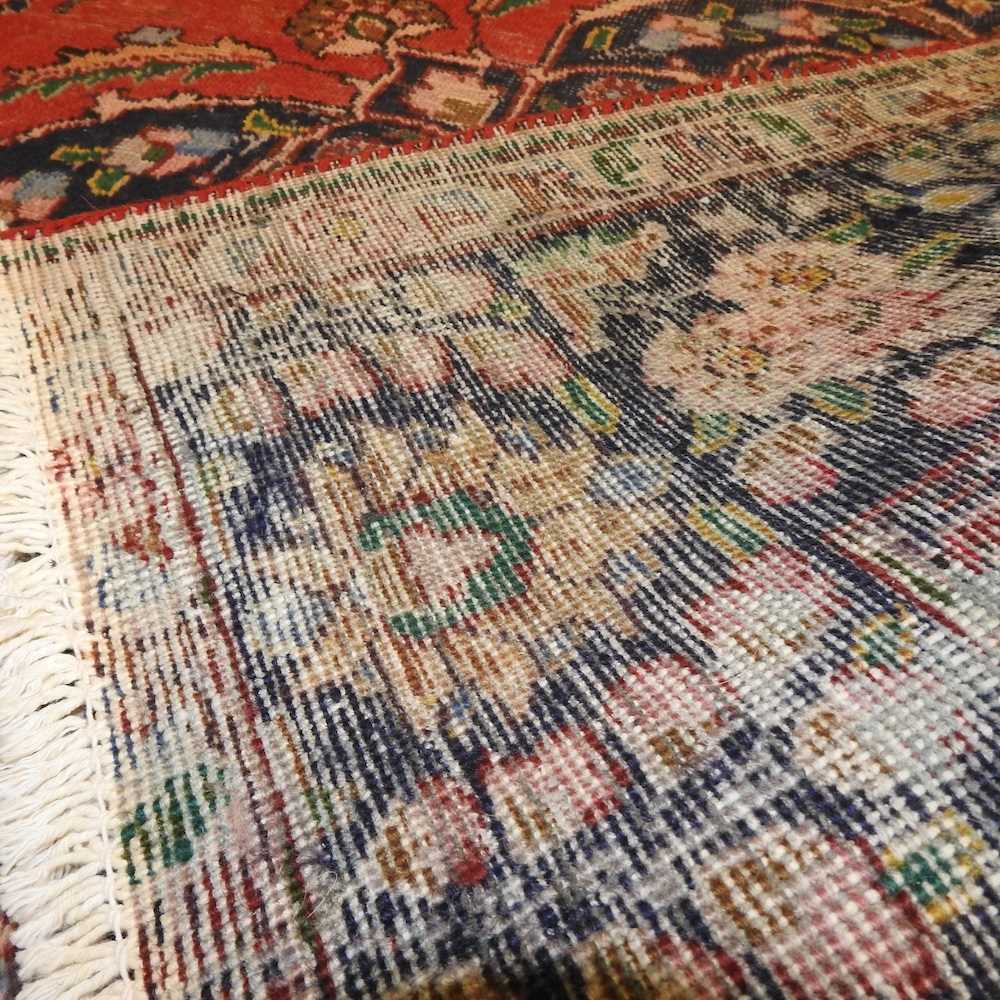 A Persian woollen carpet - Image 2 of 5
