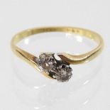 An 18 carat gold two stone diamond ring