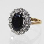 An unmarked sapphire and diamond cluster ring