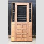 A large bespoke made oak panelled exterior doorway