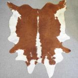 A large Hereford breed cow hide