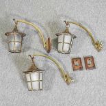 A set of three Art Nouveau style brass wall lights