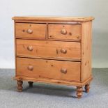 An early 20th century pine chest of drawers