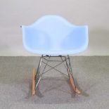 A 1960's style blue moulded plastic rocking chair