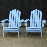 A pair of adirondack garden chairs