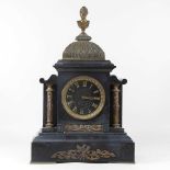 A 19th century continental slate and brass mounted mantel clock