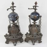 A pair of ornate 19th century fire dogs