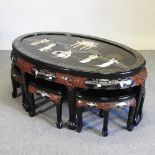 A Japanese black lacquered nest of seven occasional tables