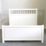 A white painted double bedstead