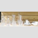 A collection of seven various cut-glass decanters