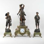 A 19th century continental spelter and onyx three piece figural clock garniture
