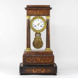 A 19th century continental rosewood cased portico clock